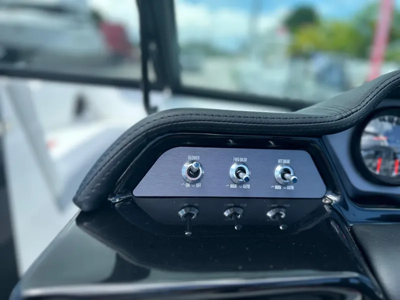 Slide: The Image of Control panel of 2023 MasterCraft NXT24 boat with switches and gauges. - 25