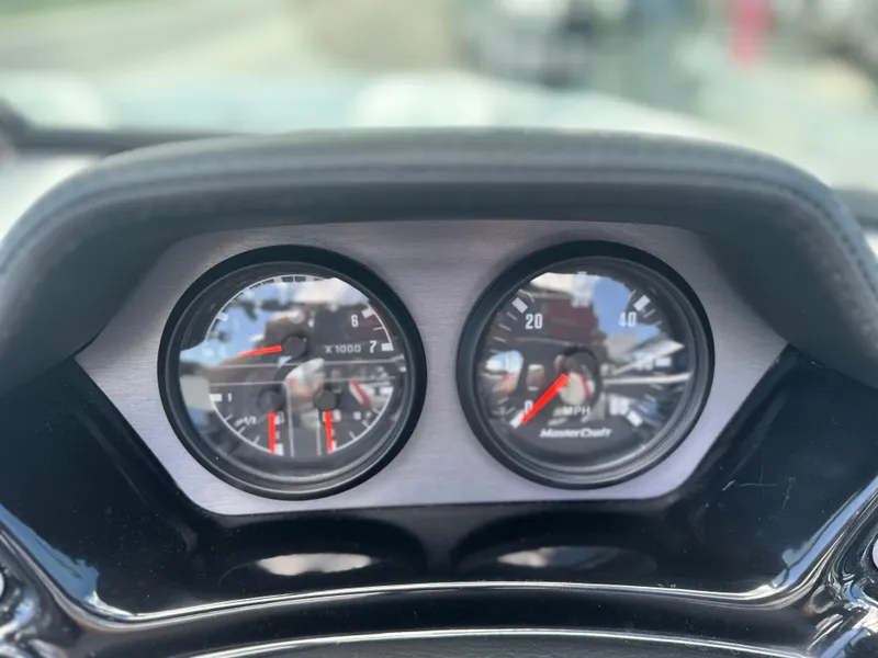 Slide: The Image of Dashboard gauges of 2023 MasterCraft NXT24 boat, close-up view. - 26