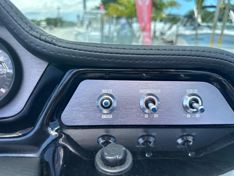 Slide: The Image of 2023 MasterCraft NXT24 dashboard with navigation and control switches. - 27