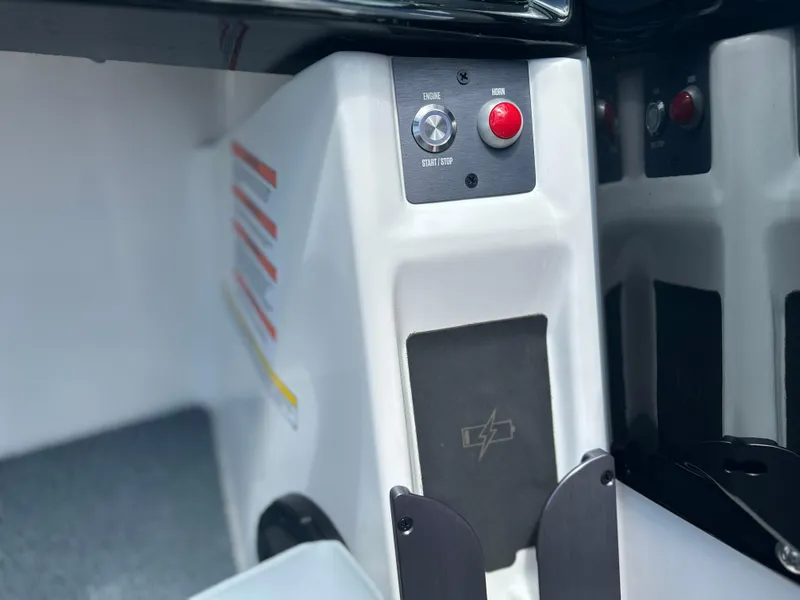 Slide: The Image of 2023 MasterCraft NXT24 boat interior control panel with buttons and labels. - 29