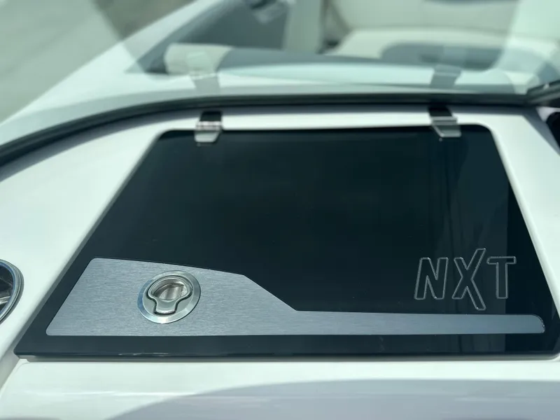 Slide: The Image of 2023 MasterCraft NXT24 boat dashboard with sleek design and modern features. - 33