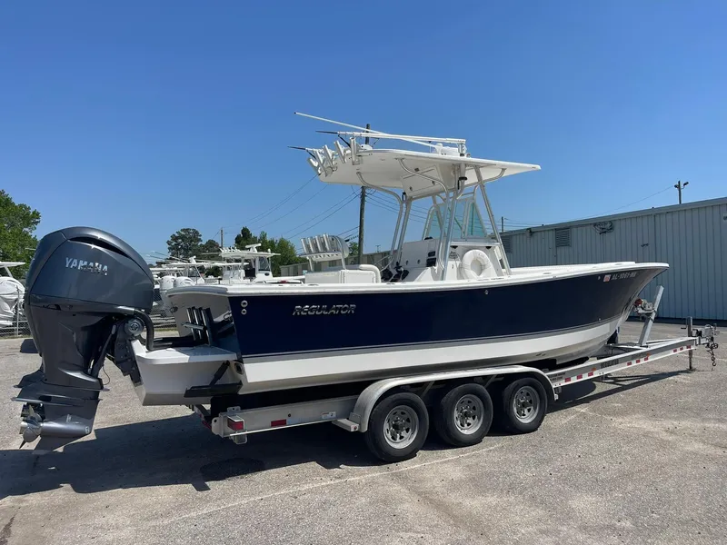Slide: The Image of 2007 Regulator 26 Forward Seating boat on trailer, featuring Yamaha outboard motor. - 1