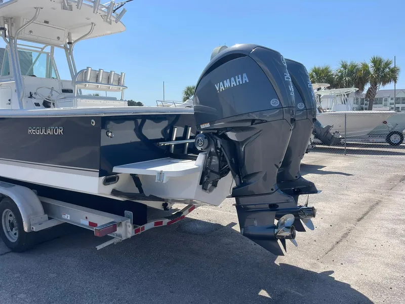 Slide: The Image of 2007 Regulator 26 Forward Seating boat with twin Yamaha outboard engines on a trailer. - 10