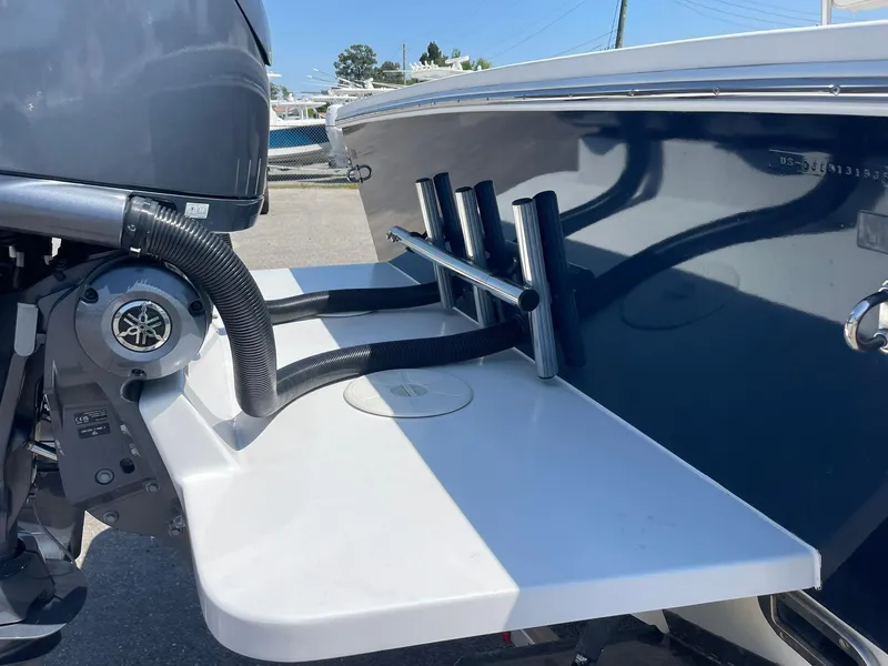 Slide: The Image of 2007 Regulator 26 Forward Seating boat with motor and rod holders. - 11