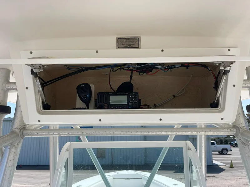 Slide: The Image of 2007 Regulator 26 Forward Seating boat console with radio equipment and wiring. - 13