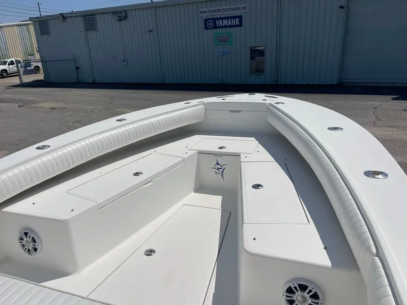 Slide: The Image of 2007 Regulator 26 Forward Seating boat with spacious deck and seating area. - 14