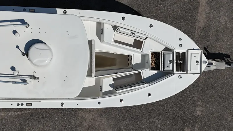 Slide: The Image of Top view of a 2007 Regulator 26 Forward Seating boat on pavement. - 25