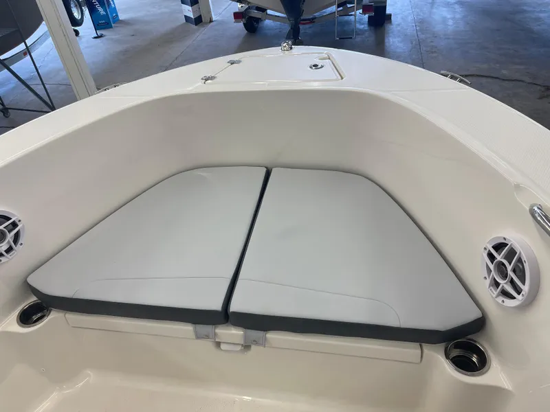 Slide: The Image of 2025 Robalo R180 Center Console boat interior with cushioned seating and speakers. - 3