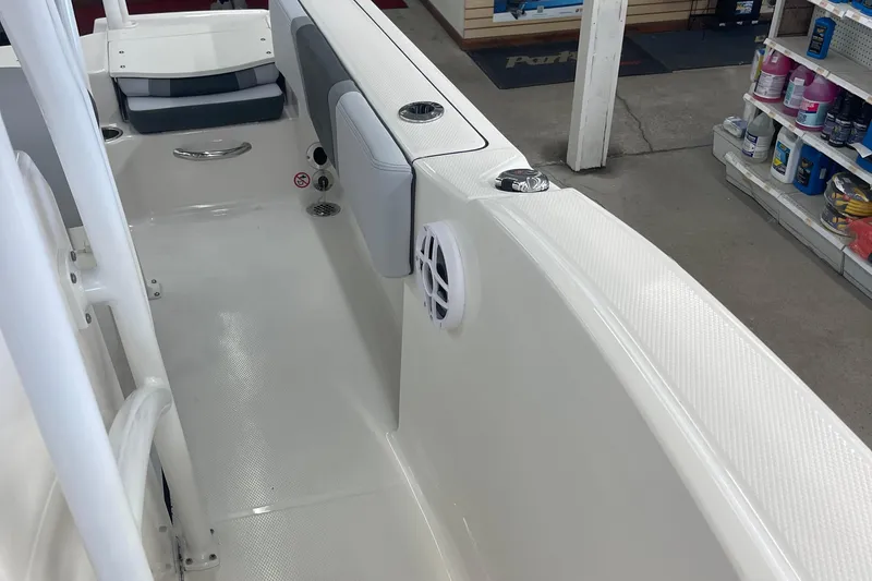 Slide: The Image of 2025 Robalo R180 Center Console boat interior with seating and storage compartments. - 6