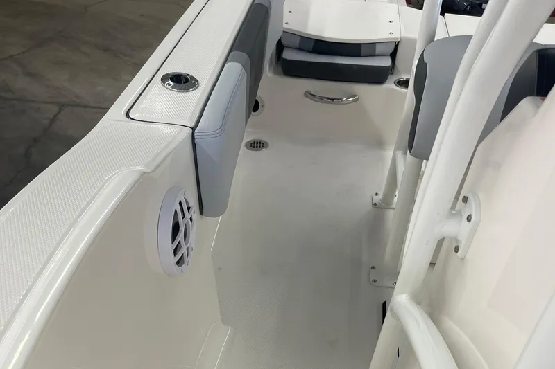 Slide: The Image of 2025 Robalo R180 Center Console boat interior with seating and speaker detail. - 7