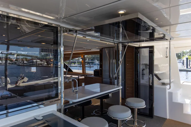 Slide: The Image of Luxurious interior of 2022 Aquila 54 Yacht with modern kitchen and seating area. - 18