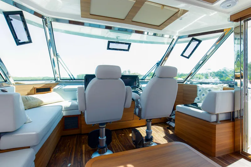 Slide: The Image of Luxurious interior of 2022 Aquila 54 Yacht with modern seating and panoramic windows. - 22