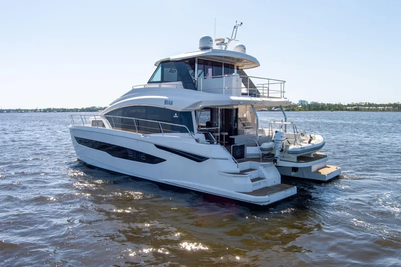 Slide: The Image of Aquila 54 Yacht 2022 cruising on open water, showcasing sleek design and luxury features. - 3