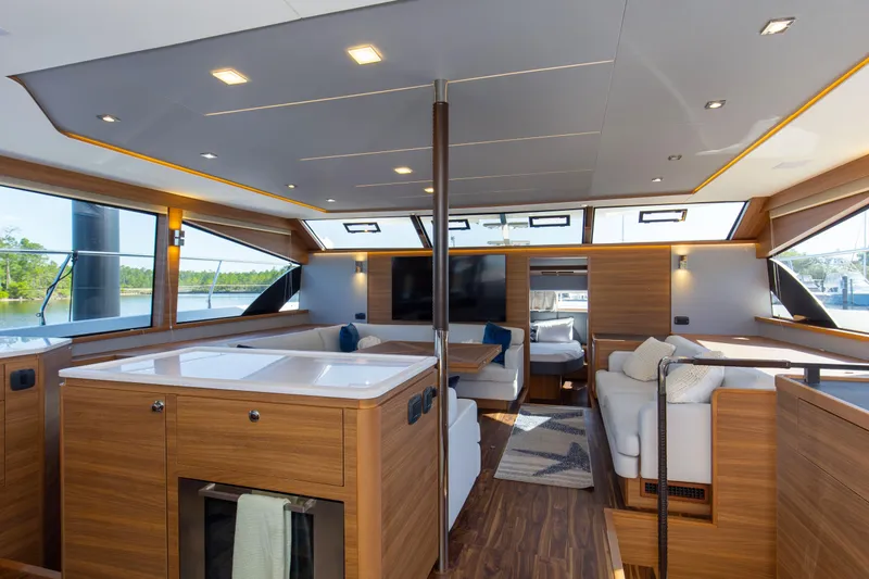 Slide: The Image of Luxurious interior of 2022 Aquila 54 Yacht with modern wood finishes and spacious seating. - 33
