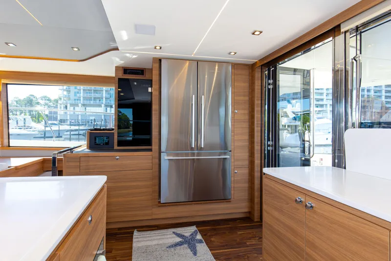 Slide: The Image of Modern kitchen interior of 2022 Aquila 54 Yacht with stainless steel appliances. - 35