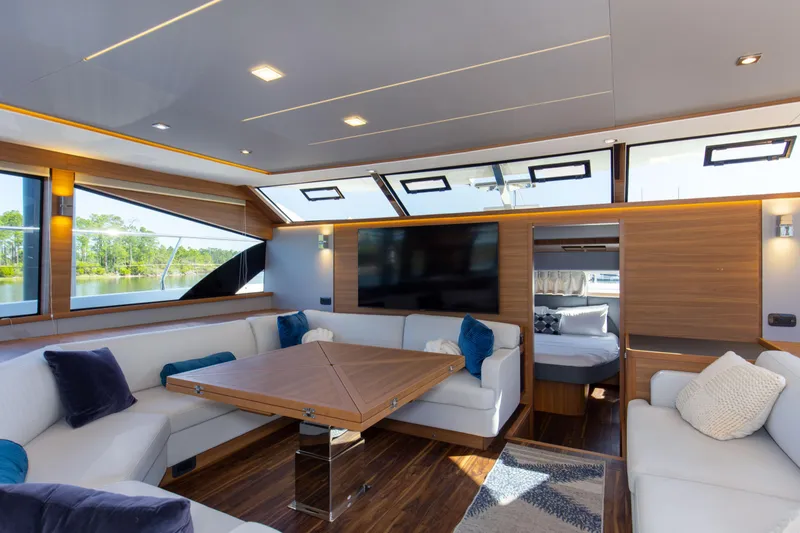 Slide: The Image of Luxurious interior of 2022 Aquila 54 Yacht with modern seating and large windows. - 36