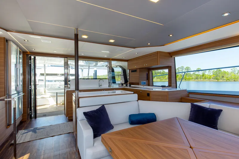 Slide: The Image of Luxurious interior of 2022 Aquila 54 Yacht with modern furnishings and scenic water view. - 37