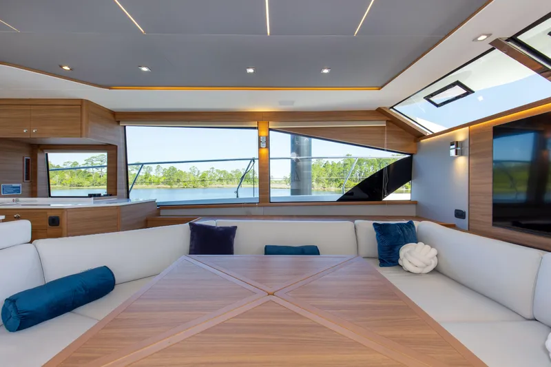 Slide: The Image of Luxurious interior of 2022 Aquila 54 Yacht with elegant seating and panoramic windows. - 38