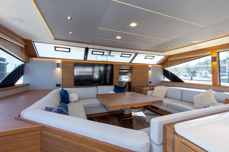Slide: The Image of Luxurious interior of 2022 Aquila 54 Yacht with modern seating and large windows. - 39