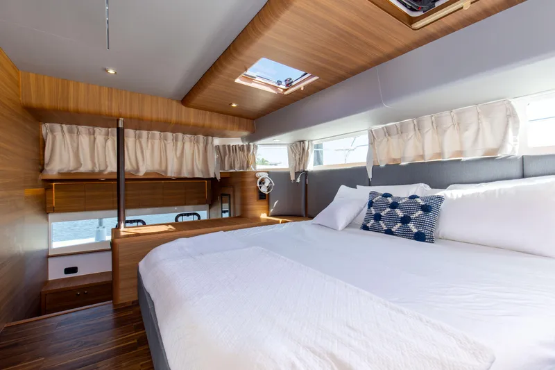 Slide: The Image of Luxurious bedroom interior of 2022 Aquila 54 Yacht with modern design and natural light. - 40