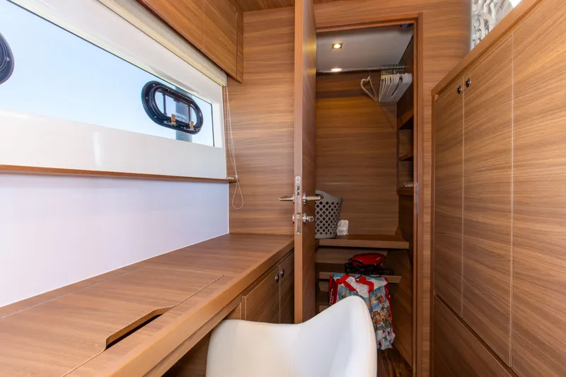 Slide: The Image of Interior of 2022 Aquila 54 Yacht with wooden cabinetry and seating. - 45
