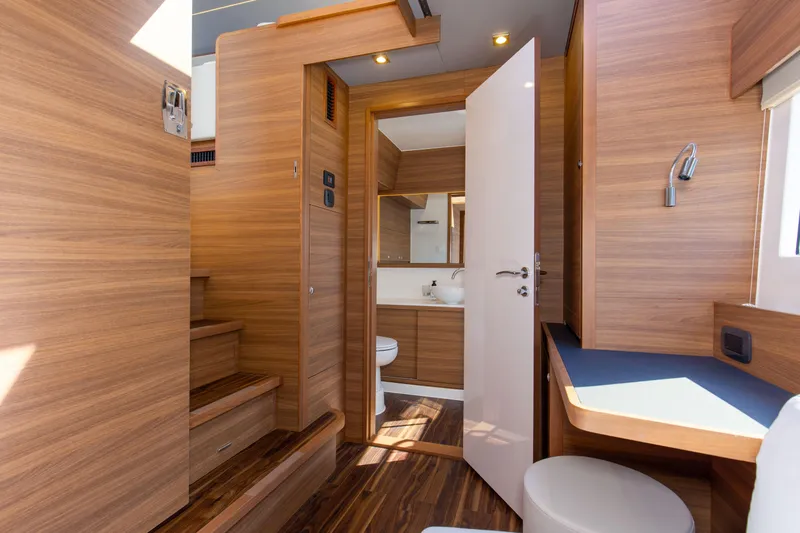 Slide: The Image of Interior of 2022 Aquila 54 Yacht featuring wooden finishes and modern design elements. - 48