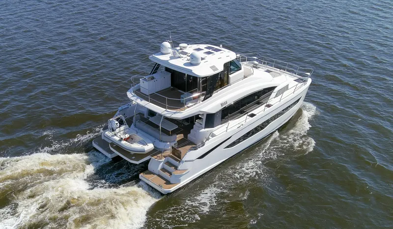 Slide: The Image of Aquila 54 Yacht 2022 cruising on open water, showcasing sleek design and luxury features. - 6