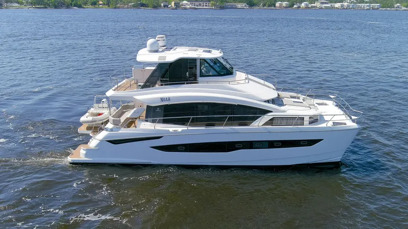 Slide: The Image of Aquila 54 Yacht 2022 cruising on a calm blue lake. - 7