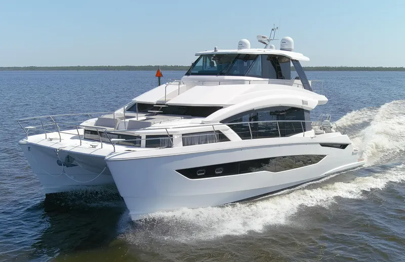 Slide: The Image of Aquila 54 Yacht 2022 cruising on open water, showcasing sleek design and luxury features. - 9