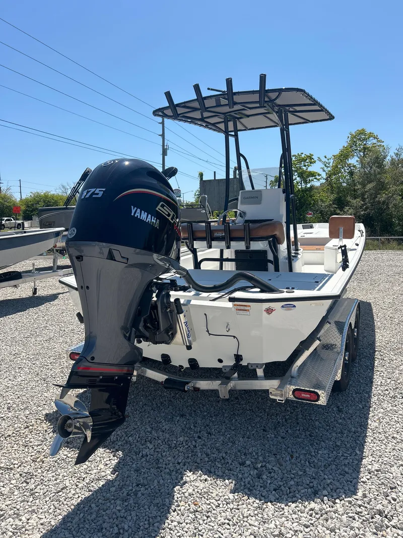 Slide: The Image of Avid 22 Recon 2025 boat with Yamaha 175 engine on gravel lot. - 8