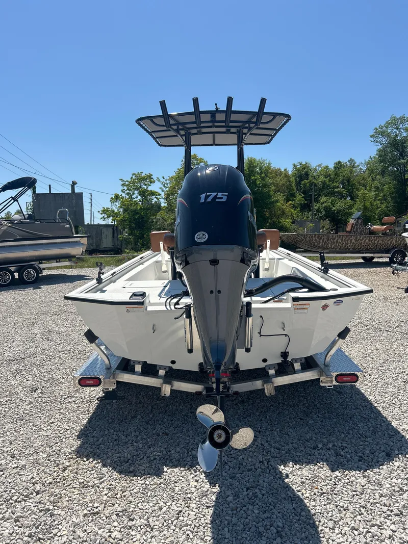 Slide: The Image of Avid 22 Recon 2025 boat with 175 horsepower engine on gravel lot. - 9