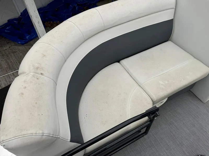 Slide: The Image of White and gray boat seating on a 2017 Larson Escape Cruze. - 3