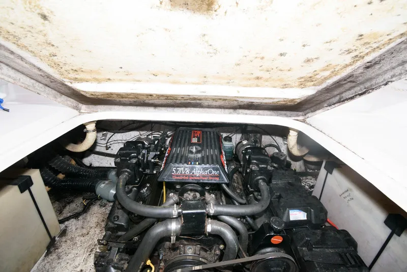 Slide: The Image of Engine compartment of a 1995 Monterey 246 SEL cruiser, featuring a 5.7L Alpha One engine. - 13