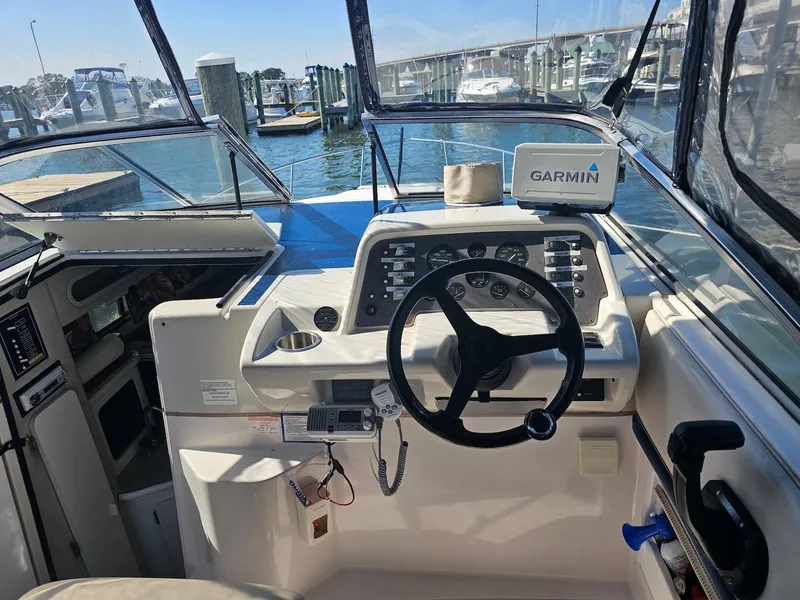 Slide: The Image of Cockpit of a 1995 Monterey 246 SEL cruiser with Garmin navigation system, docked at marina. - 5