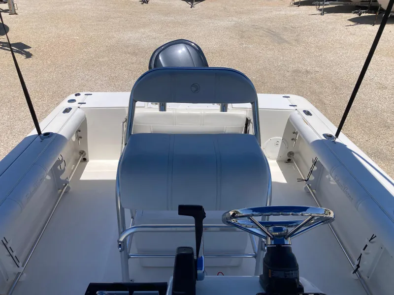 Slide: The Image of 2007 Edgewater 205CC boat interior with steering wheel and seating, viewed from the helm. - 12
