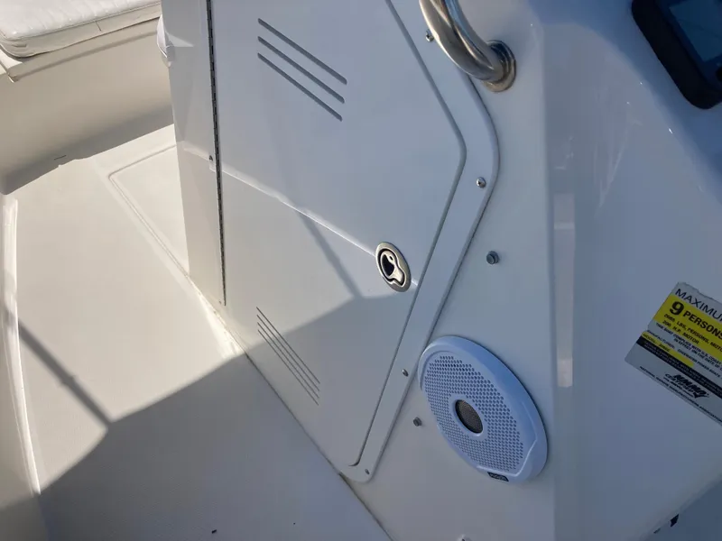 Slide: The Image of 2007 Edgewater 205CC boat interior with storage compartment and speaker. - 15