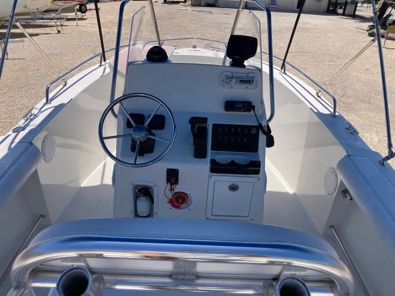 Slide: The Image of 2007 Edgewater 205CC boat cockpit with steering wheel and control panel. - 6