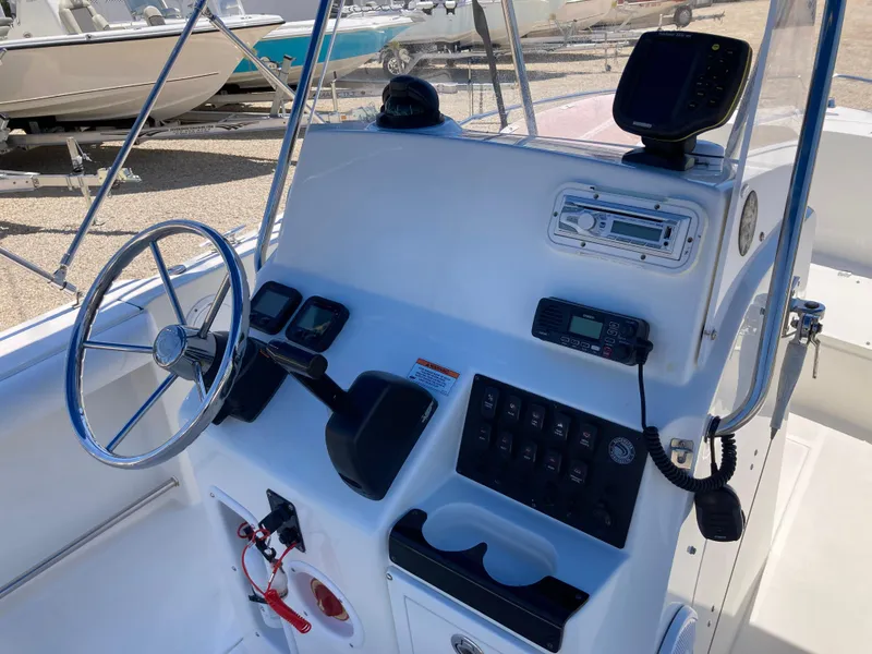 Slide: The Image of 2007 Edgewater 205CC boat console with steering wheel, gauges, and navigation equipment. - 7