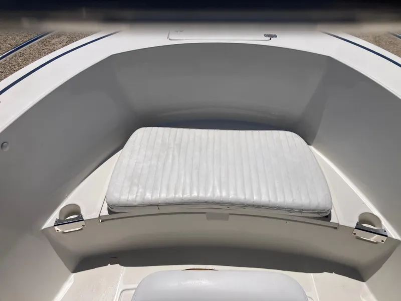 Slide: The Image of 2007 Edgewater 205CC boat interior with cushioned seating area. - 8