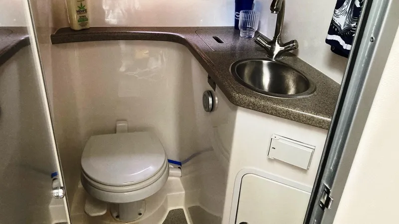Slide: The Image of 2008 Rinker 400 Express Cruiser bathroom with sink and toilet. - 18