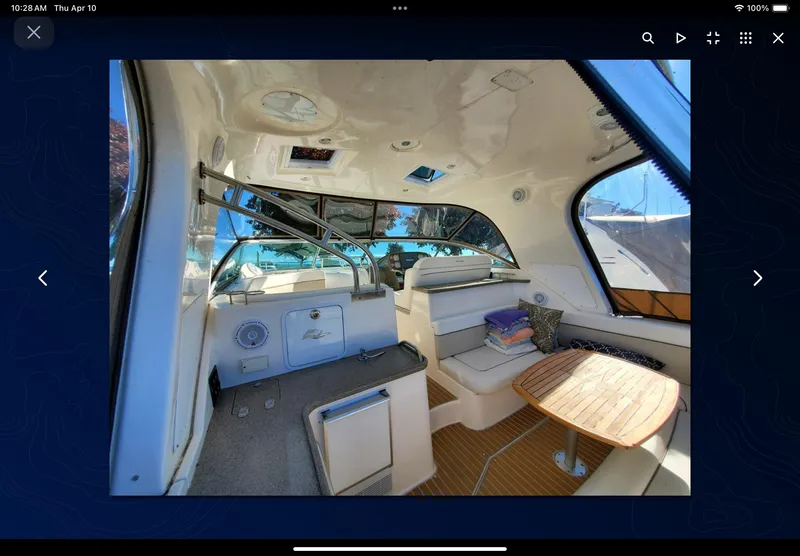 Slide: The Image of 2008 Rinker 400 Express Cruiser interior with seating and table, featuring modern design elements. - 27