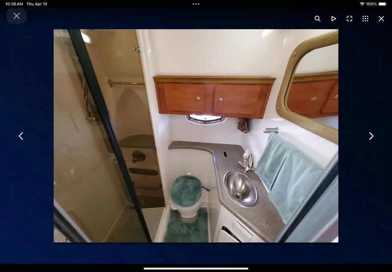 Slide: The Image of 2008 Rinker 400 Express Cruiser bathroom with sink, toilet, and shower. - 29