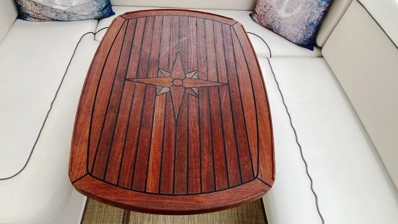 Slide: The Image of Wooden table with star design on 2008 Rinker 400 Express Cruiser yacht. - 5