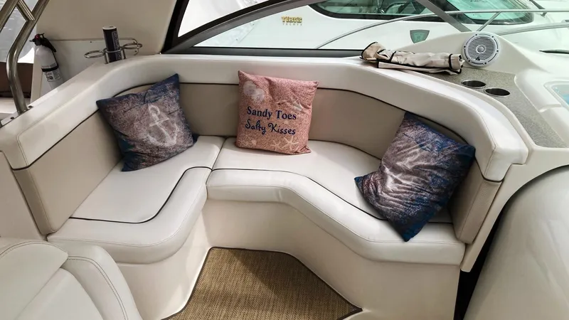 Slide: The Image of 2008 Rinker 400 Express Cruiser interior with cozy seating and decorative pillows. - 9