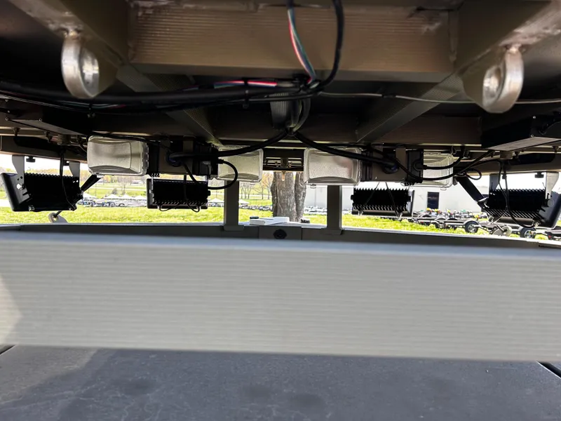 Slide: The Image of Underside view of 2024 Tracker Grizzly 2072 CC Sportsman boat, showcasing wiring and components. - 13