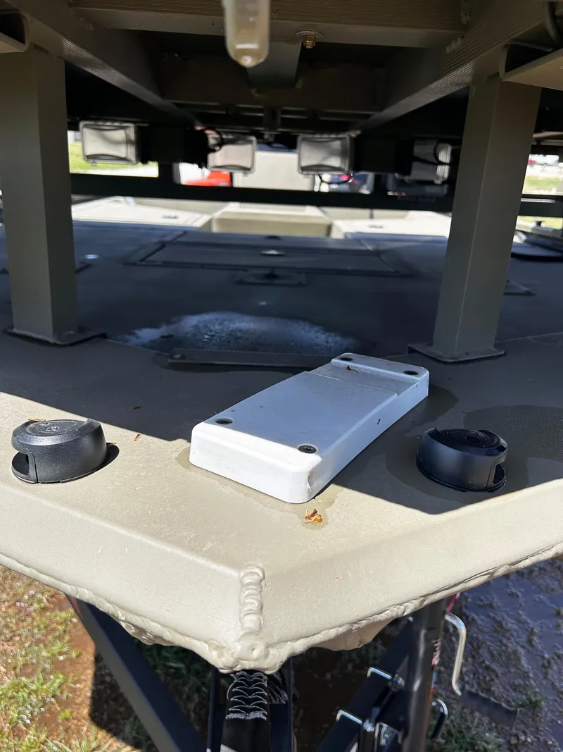 Slide: The Image of 2024 Tracker Grizzly 2072 CC Sportsman boat underside, showcasing structural details and components. - 25