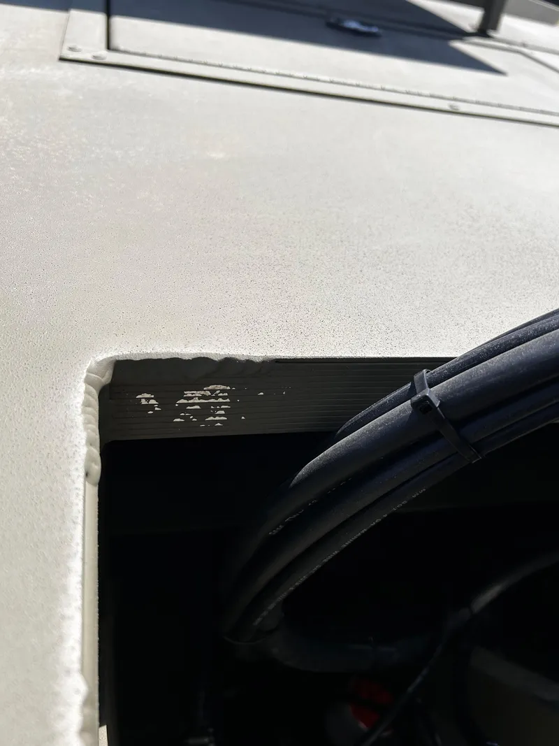 Slide: The Image of 2024 Tracker Grizzly 2072 CC Sportsman boat detail with visible wiring. - 27