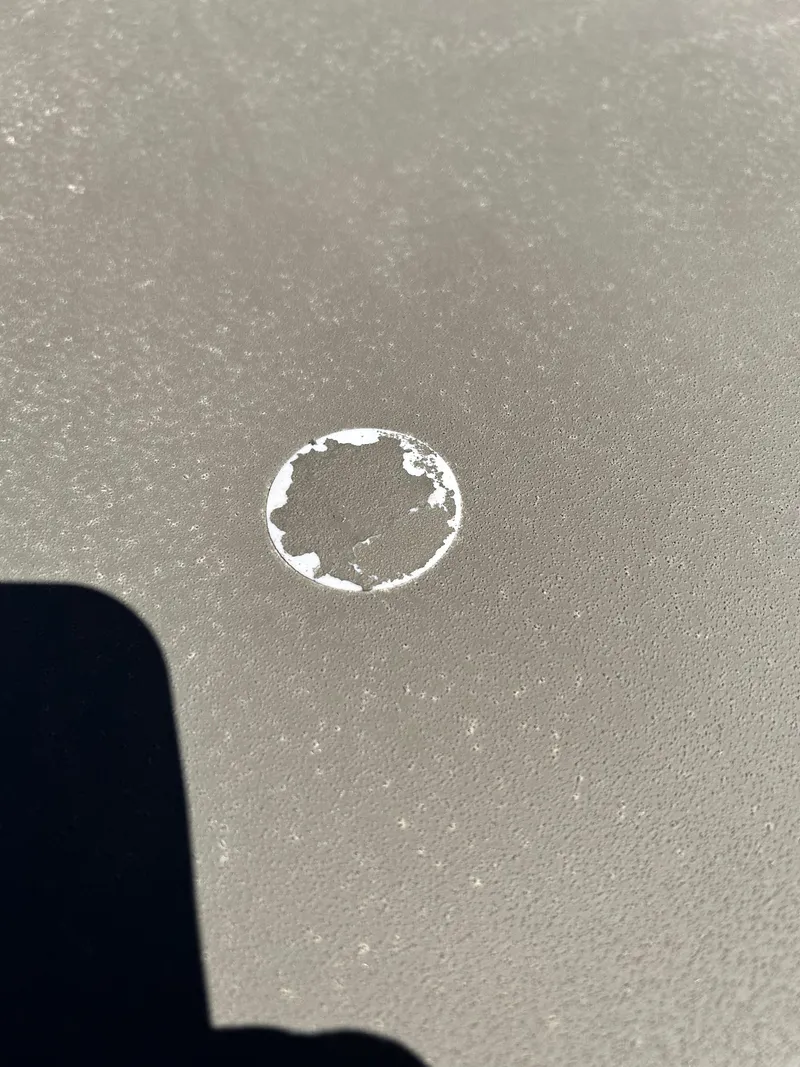 Slide: The Image of Close-up of a circular mark on a 2024 Tracker Grizzly 2072 CC Sportsman surface. - 4