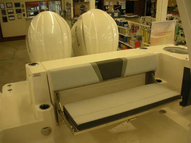 Slide: The Image of 2025 Robalo R270 Center Console boat with dual engines and foldable seating. - 16