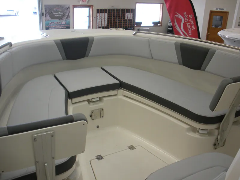Slide: The Image of 2025 Robalo R270 Center Console boat interior with cushioned seating and modern design. - 3